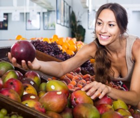 Woman buying fruit Stock Photo