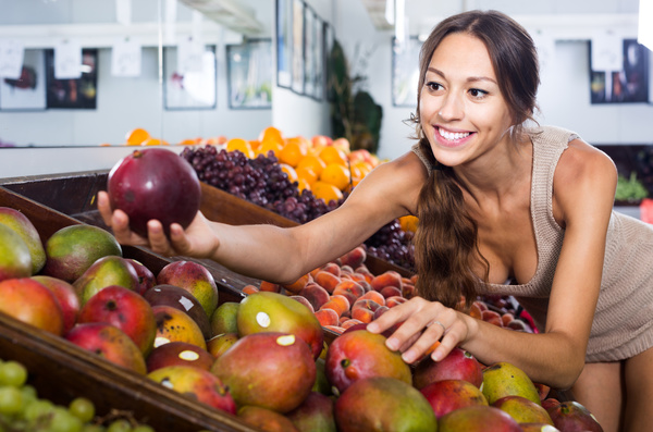 Woman buying fruit Stock Photo