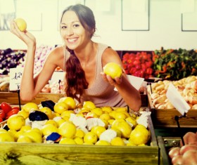 Woman buying lemon Stock Photo