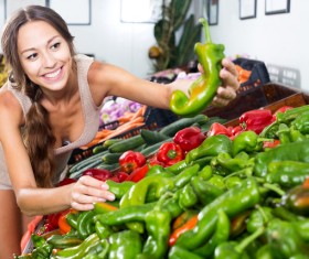 Woman buying peppers Stock Photo