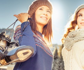 Woman holding skates Stock Photo 03