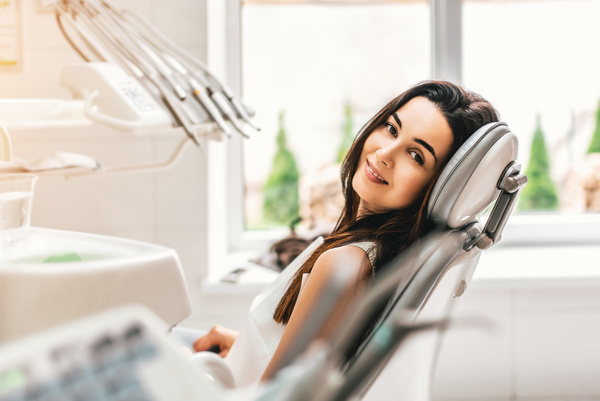 Woman sitting in the dental clinic Stock Photo