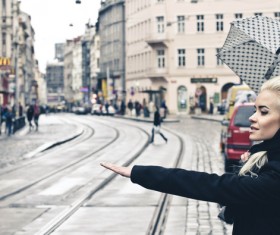 Woman taking taxi Stock Photo