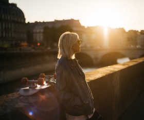 Young blond woman posing under sunlight Stock Photo