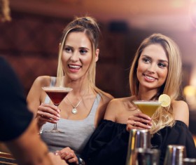 Young friends who drink in bar Stock Photo 02