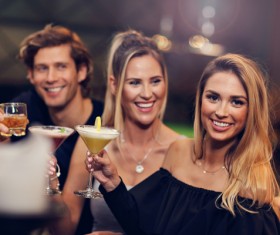 Young friends who drink in bar Stock Photo 03