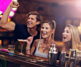 Young friends who drink in bar Stock Photo 05