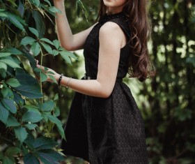 Young lady outdoors wearing black skirt Stock Photo 01