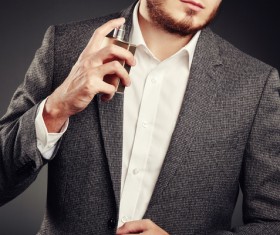 Young man spraying perfume Stock Photo 02