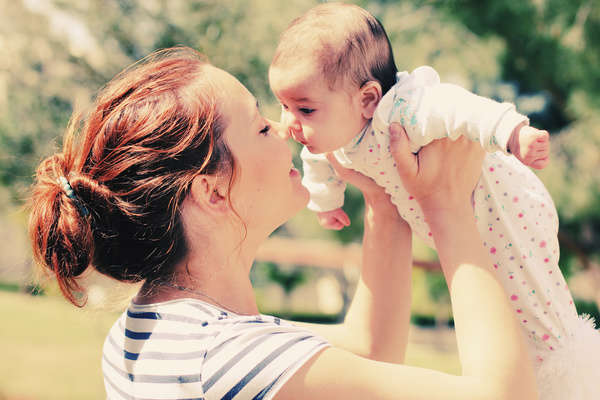 Young mother with baby Stock Photo