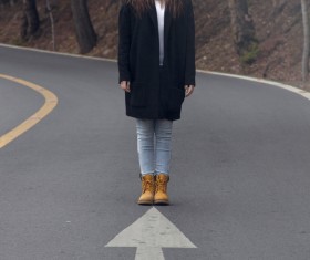 Young woman with scary posing style on road Stock Photo