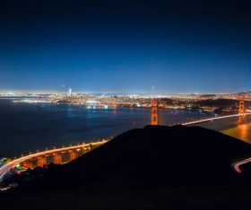 bright bridge in cityscape at night Stock Photo