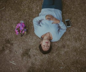 woman relaxing on ground Stock Photo