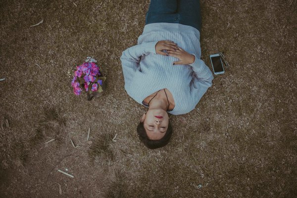 woman relaxing on ground Stock Photo