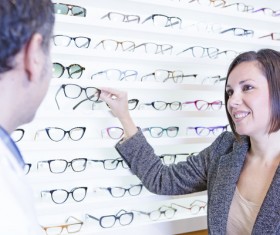 woman who chooses glasses Stock Photo