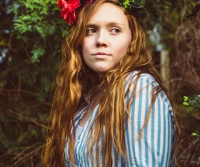 young blonde woman with flowers wreath decoration Stock   Photo