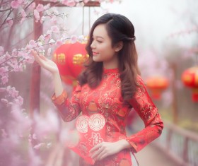 Beautiful asian girl in red cheongsam dress Stock Photo