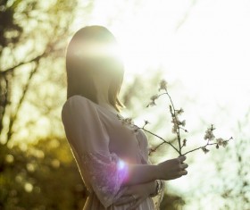 Beautiful young woman posing under sunlight Stock Photo