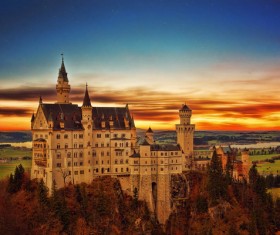 Castle on the top of the mountain at dusk Stock Photo