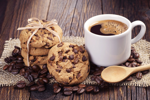 Coffee with chocolate chip cookie and coffee beans Stock Photo