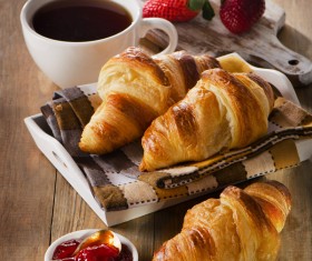 Coffee with croissant and strawberry jam Stock Photo