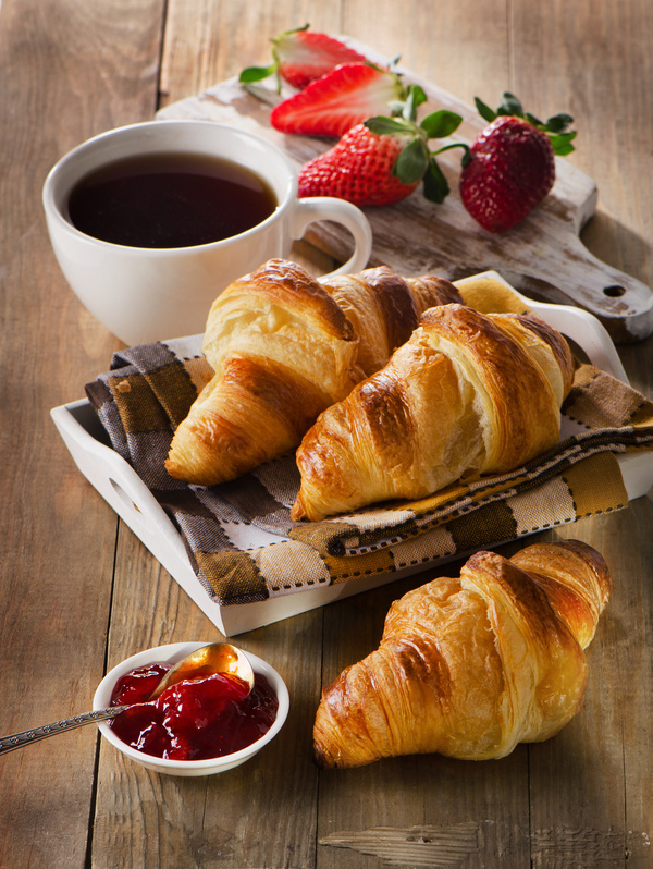 Coffee with croissant and strawberry jam Stock Photo