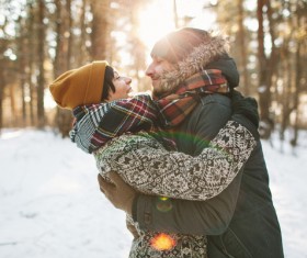 Couple hugging on the snow Stock Photo