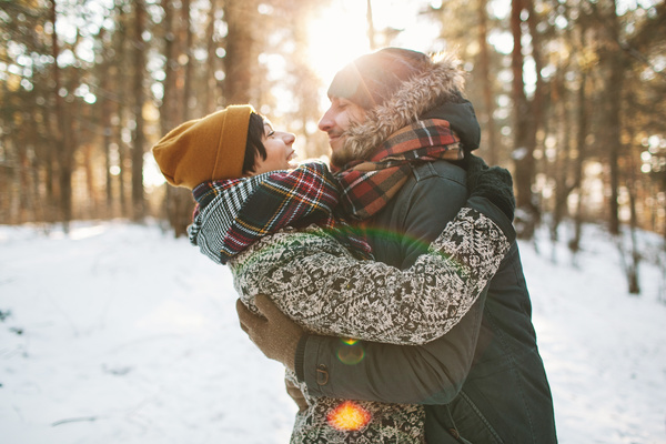 Couple hugging on the snow Stock Photo