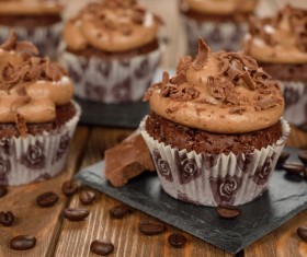 Cupcakes and coffee beans on the table Stock Photo