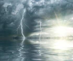 Dark clouds and lightning at sea Stock Photo