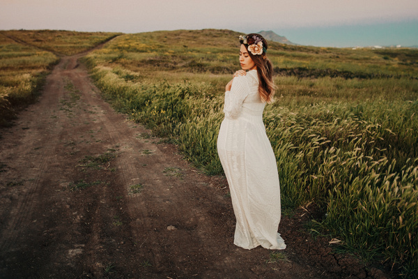 Elegant woman takes pictures on dirt roads Stock Photo