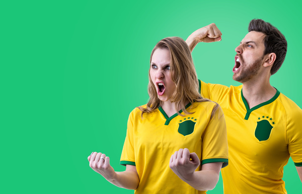 Excited male and female fans Stock Photo
