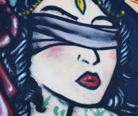 Eyes wrapped woman painting Stock Photo