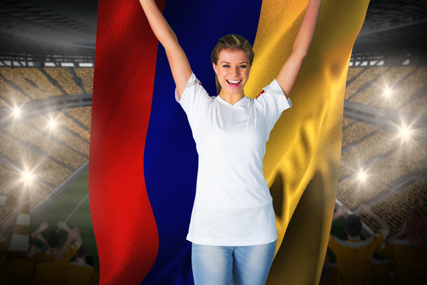 Female football fan holding the flag Stock Photo