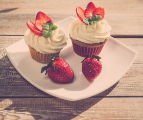 Fruit cream cupcakes Stock Photo