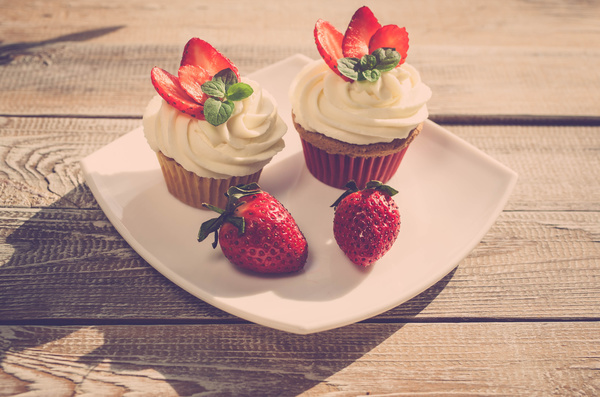 Fruit cream cupcakes Stock Photo