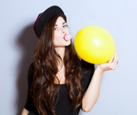 Girl holding balloon Stock Photo