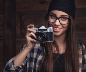 Girl holding camera Stock Photo