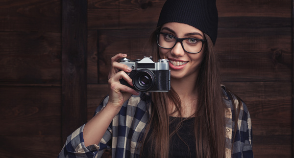 Girl holding camera Stock Photo