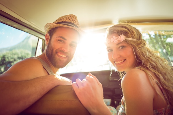 Inside the car smiling couple Stock Photo