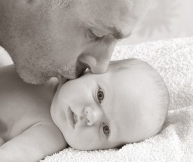Kiss the baby father Stock Photo
