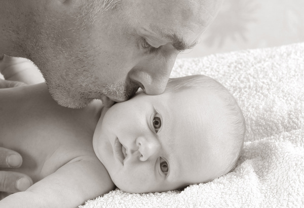 Kiss the baby father Stock Photo