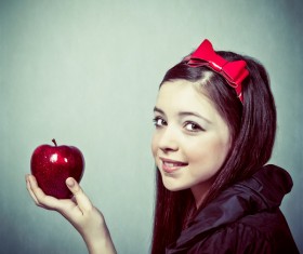 Little girl holding red apple Stock Photo