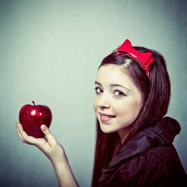 Little girl holding red apple Stock Photo