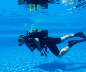 Man practicing diving in the swimming pool Stock Photo 01