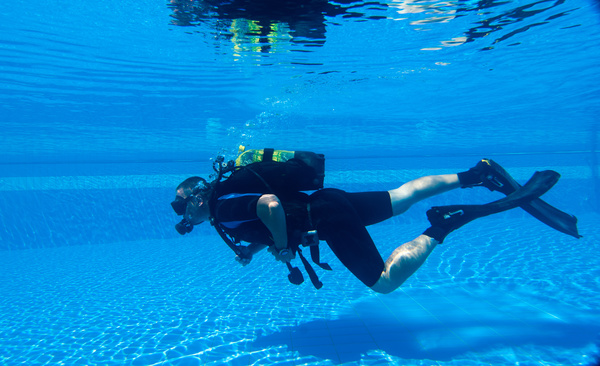 Man practicing diving in the swimming pool Stock Photo 01
