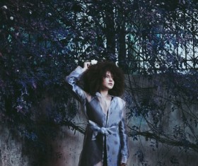 Model posing outdoor with unique hairstyle Stock Photo