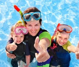 Mother diving with her daughter Stock Photo