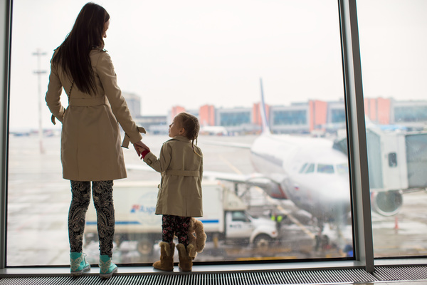 Mother with daughter to see the plane Stock Photo