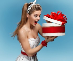 Open gift box surprised woman Stock Photo